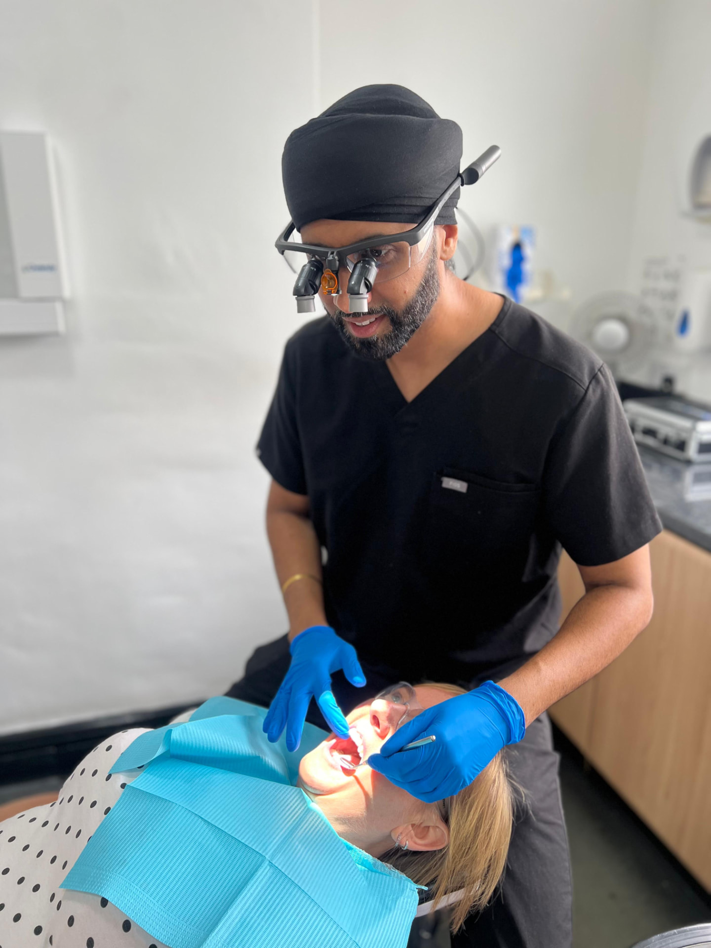 A dentist checking a patient's clear aligner progress